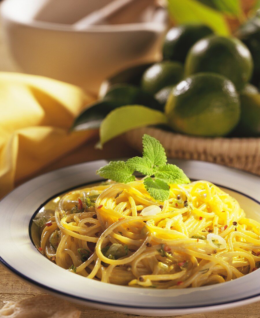 Spaghettini with lime sauce, spring onions and herbs