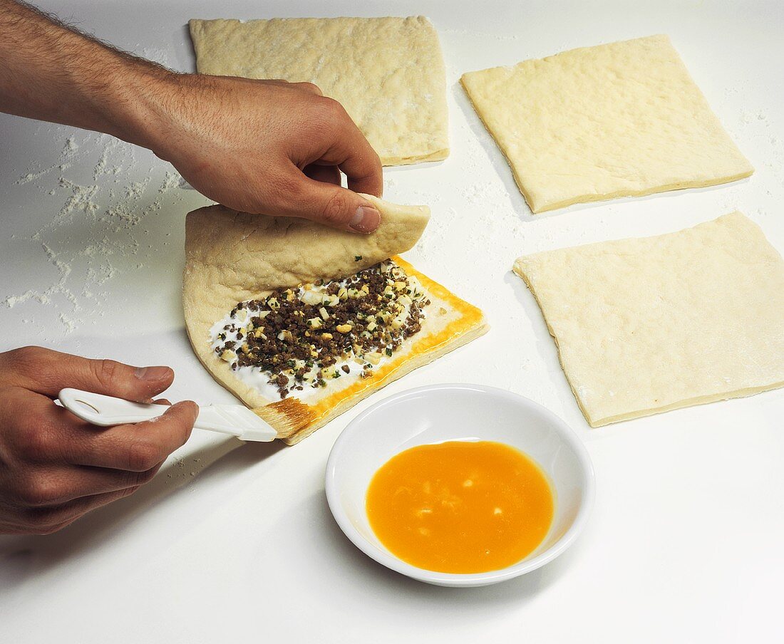 Making pierogis with mince filling