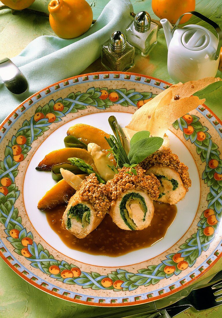 Chicken & spinach rolls with sesame sauce, asparagus & fruit