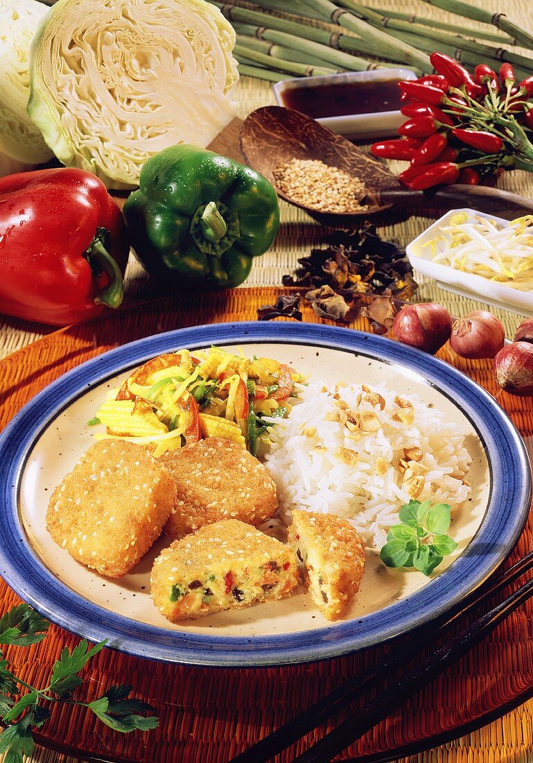 Asian rissoles with rice & sweetcorn, peppers & cabbage