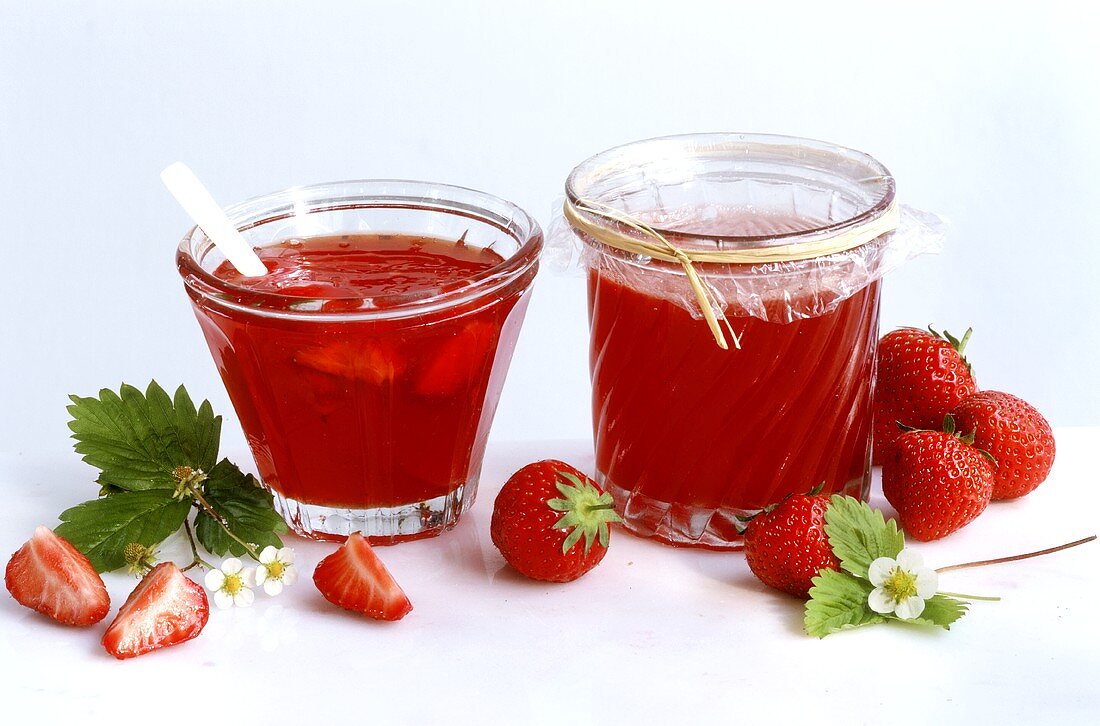 Strawberry jelly with rose petals in two preserving jars