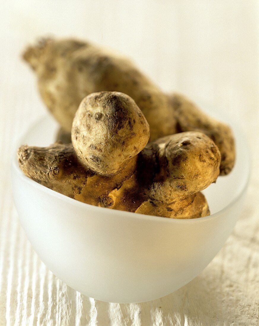 Jerusalem artichokes in white bowl