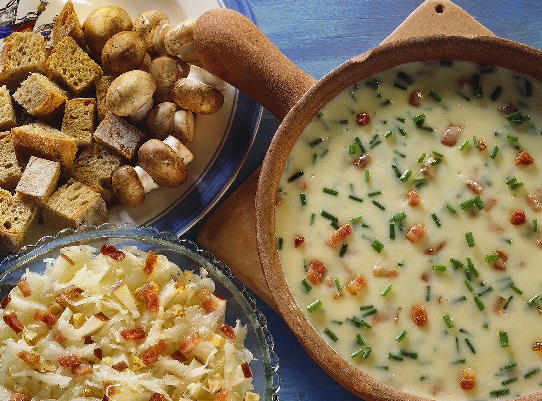 Peasant's fondue (cheese): bread, mushrooms, cabbage salad