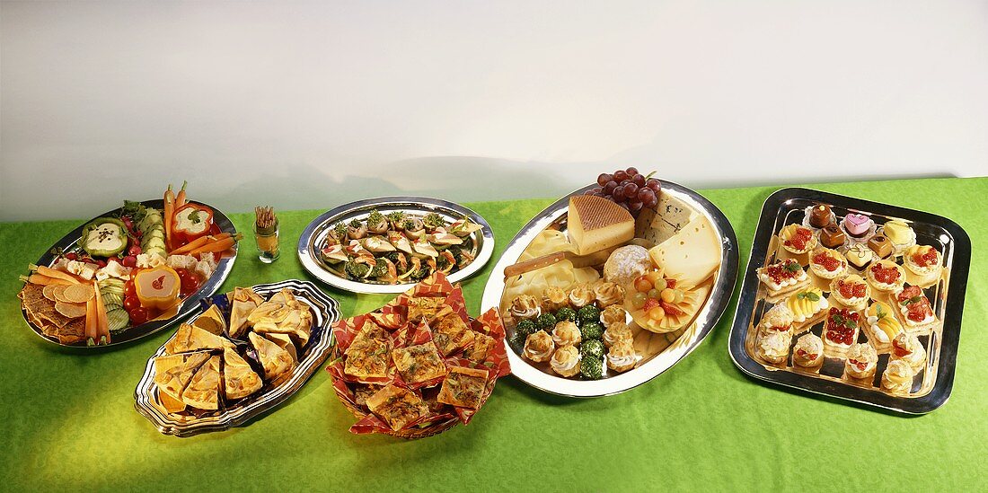 Several platters of sweet and savoury snacks