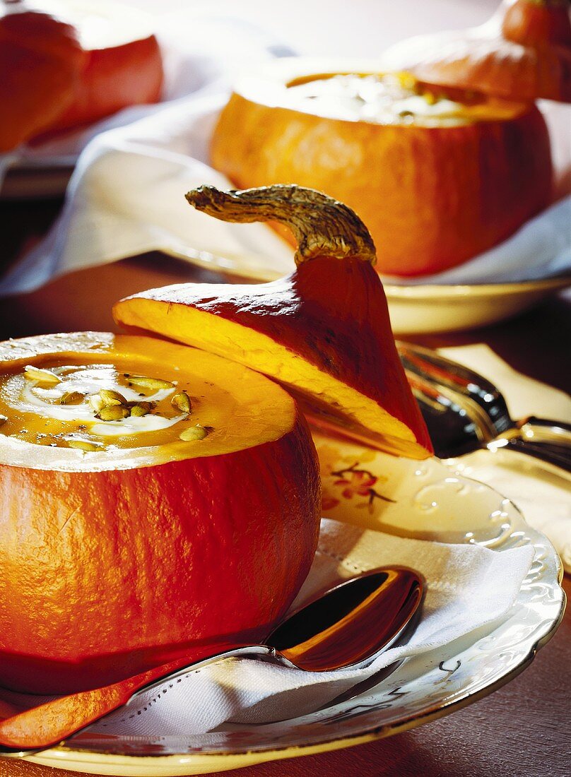 Pumpkin soup with pumpkin seeds in hollowed-out pumpkins