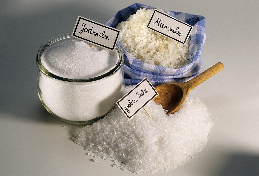 Iodine salt in jar, sea salt im bag and coarse salt