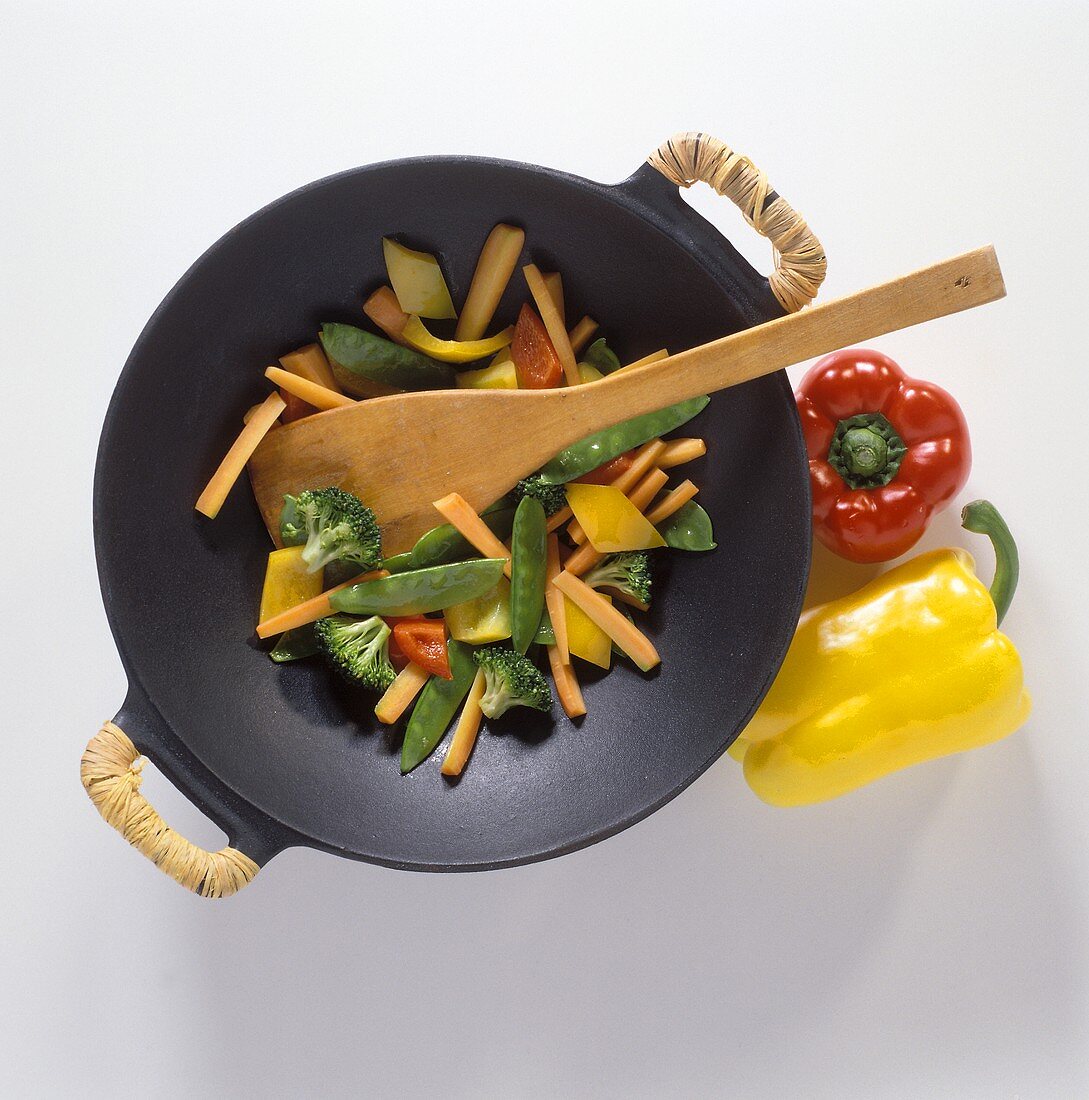 Vegetables in wok with bast-wrapped handles