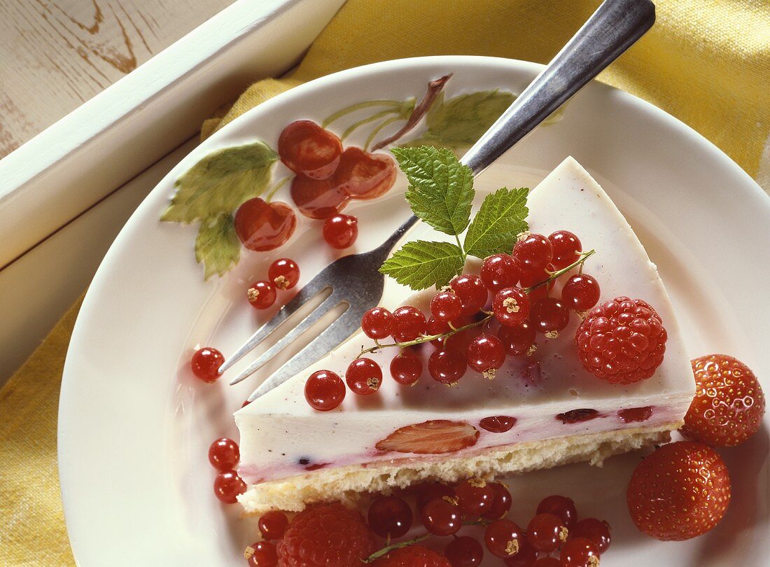 Yoghurt cake with raspberries, redcurrants, strawberries