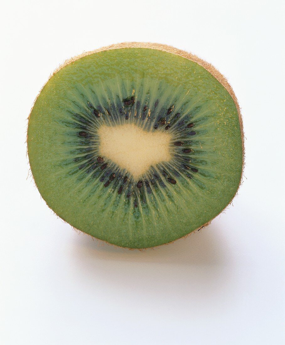 Halved kiwi fruit, lying on its side