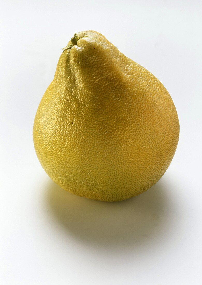 A whole pomelo on white background