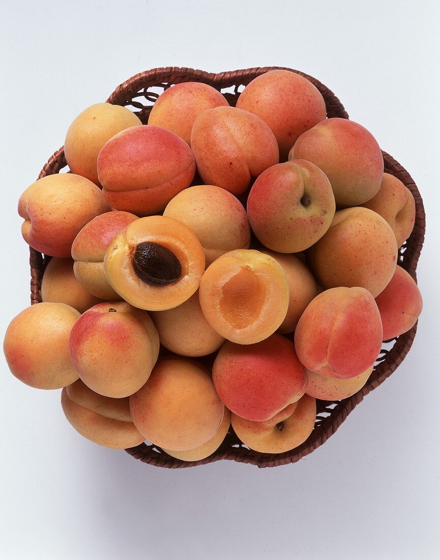 Apricots in a Basket; One Halved