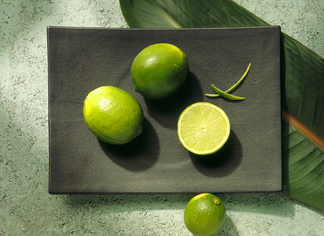 Limes, whole and halved