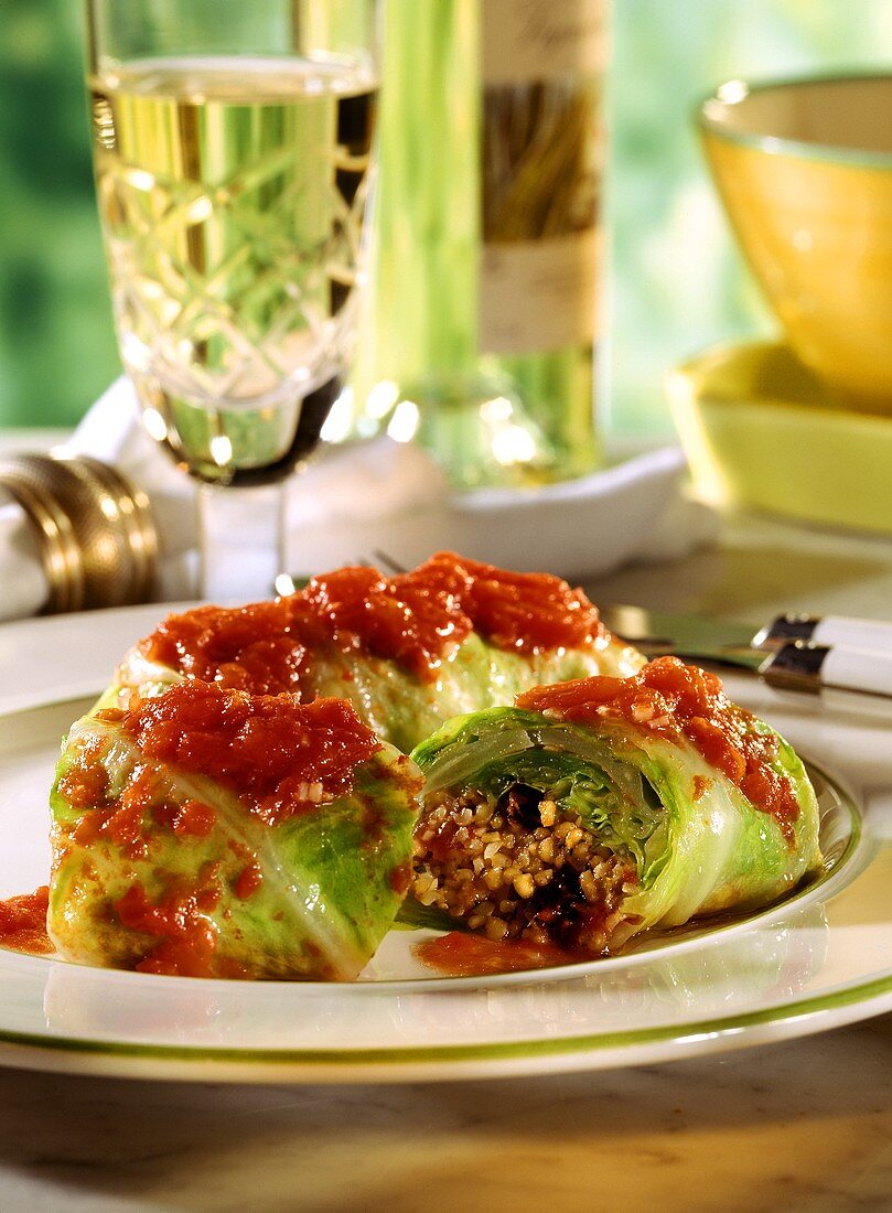 Cabbage roulades with grits and tomatoes