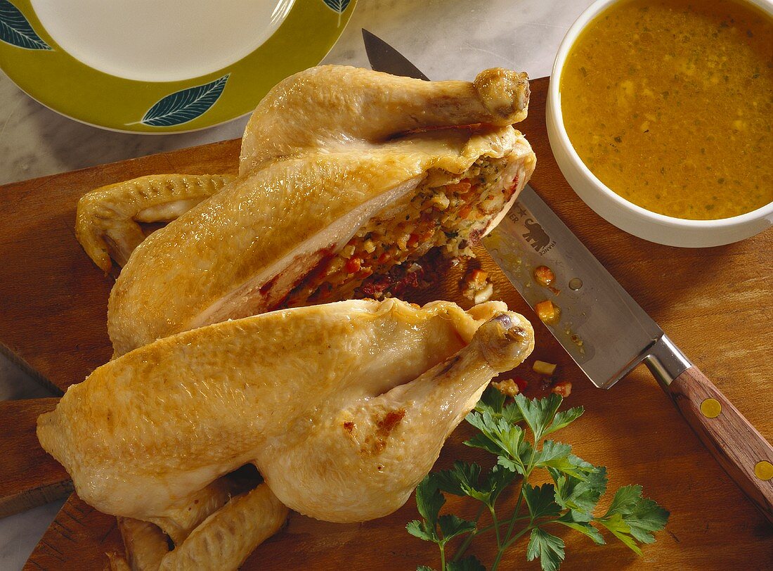 Braised poularde with stuffing, cut into two halves