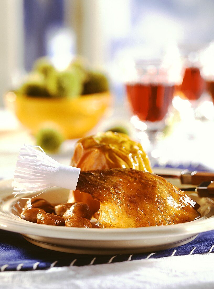Christmas goose (leg with paper frill), baked apples,chestnuts