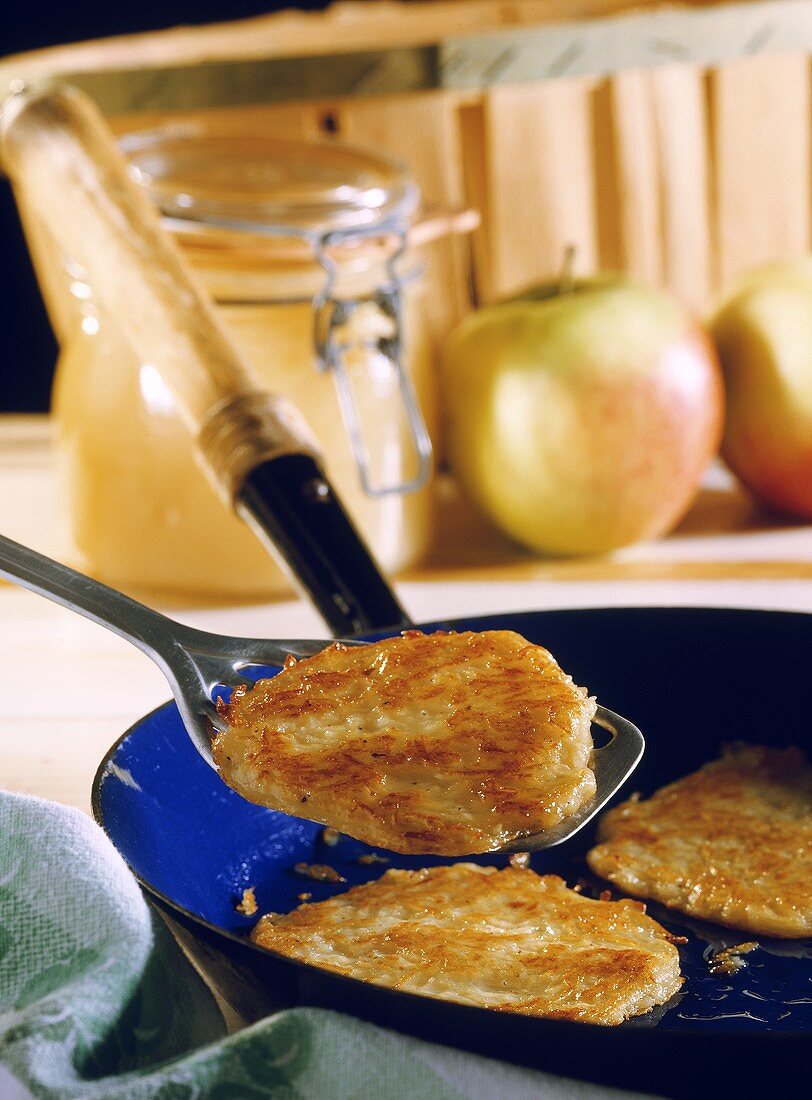 Potato pancake in the pan and on spatula