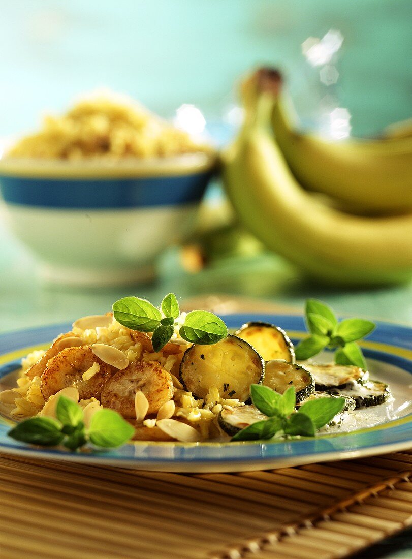 Curried rice with bananas, courgettes & flaked almonds