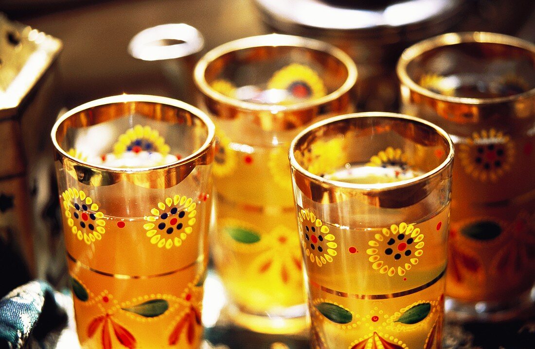 Mint tea in colourful glasses with gold rim