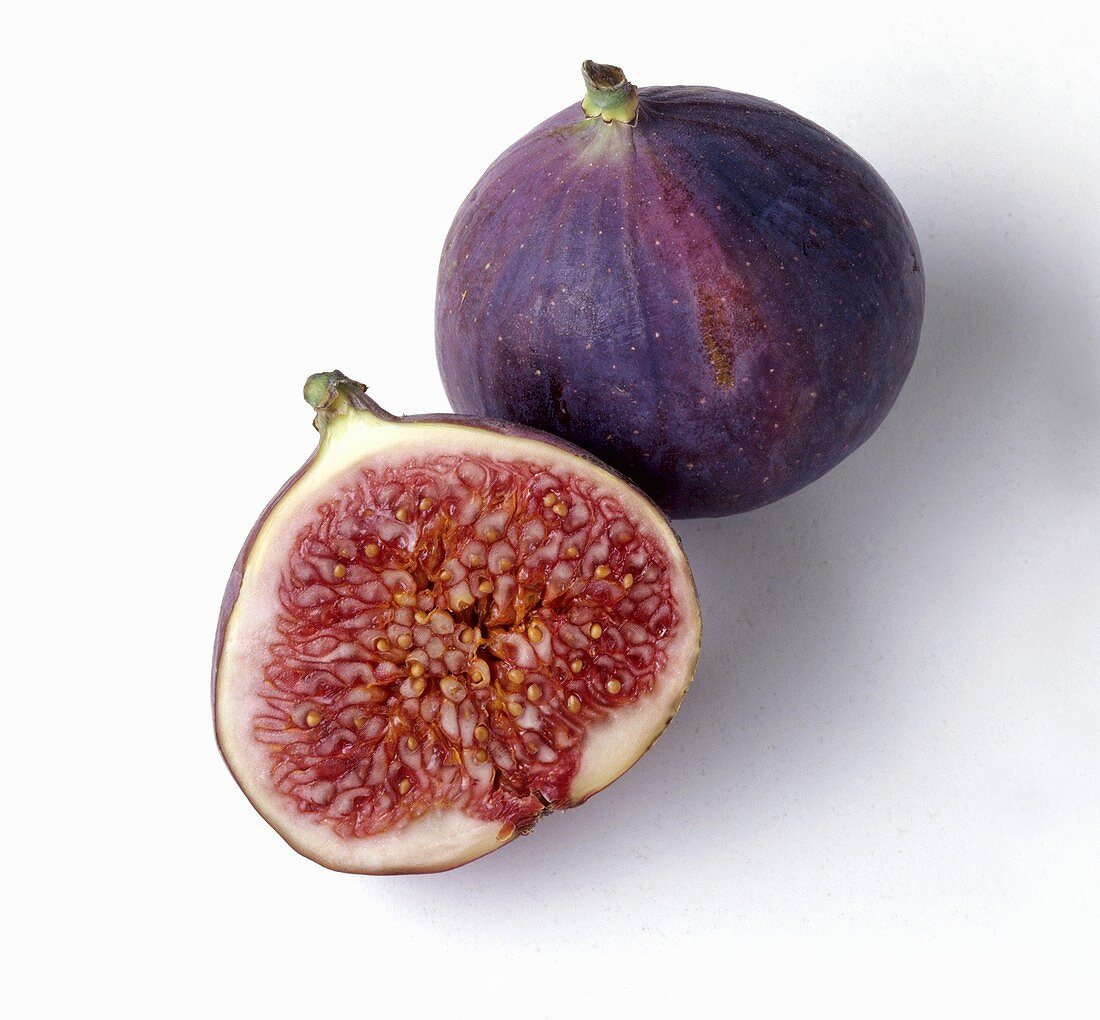 A fig and half a fig on white background