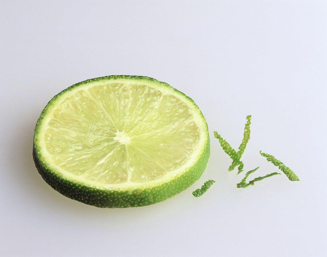 A slice of lime on light background