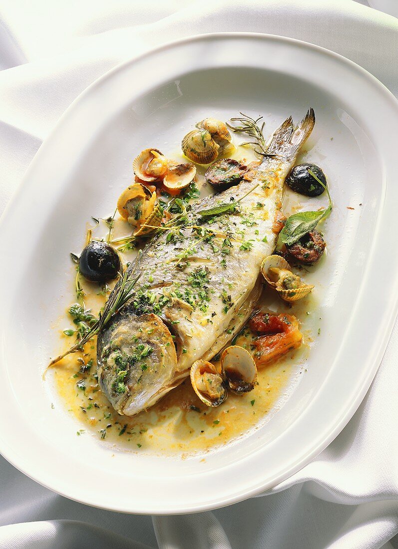 Fried gilthead bream with herbs, mussels and olives