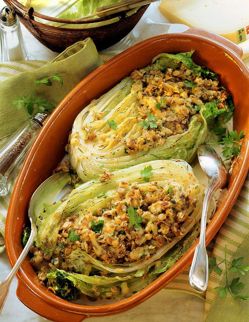 Gratin of Chinese cabbage with oat flakes in baking dish
