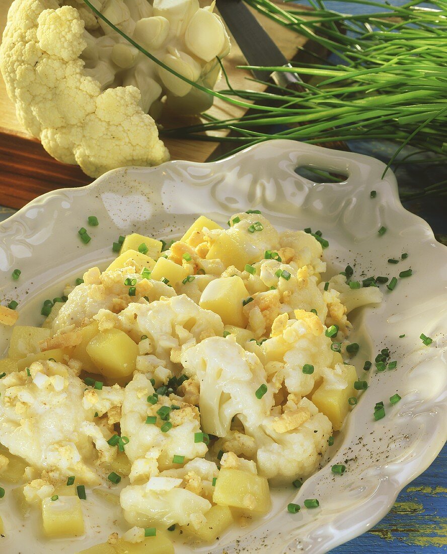 Cauliflower with egg sauce, potatoes and chives