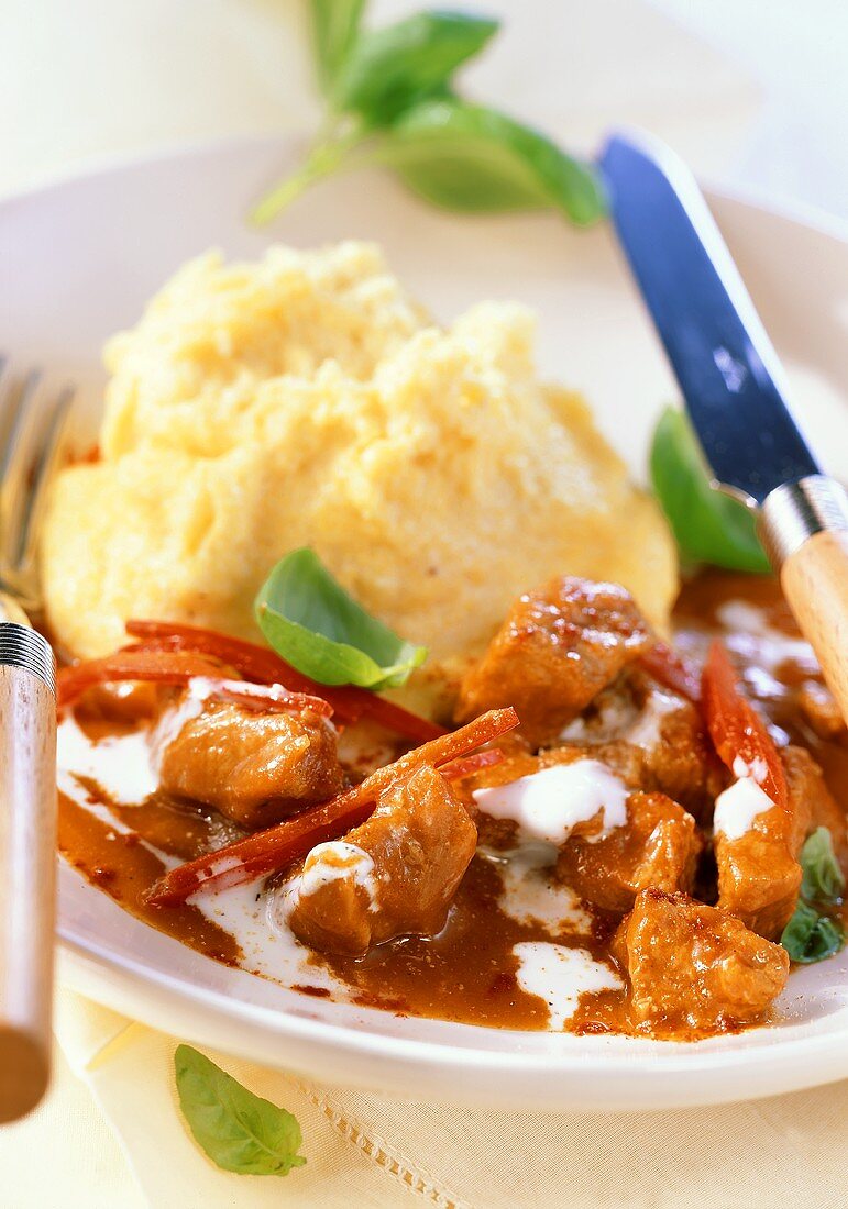 Veal goulash with sour cream and polenta