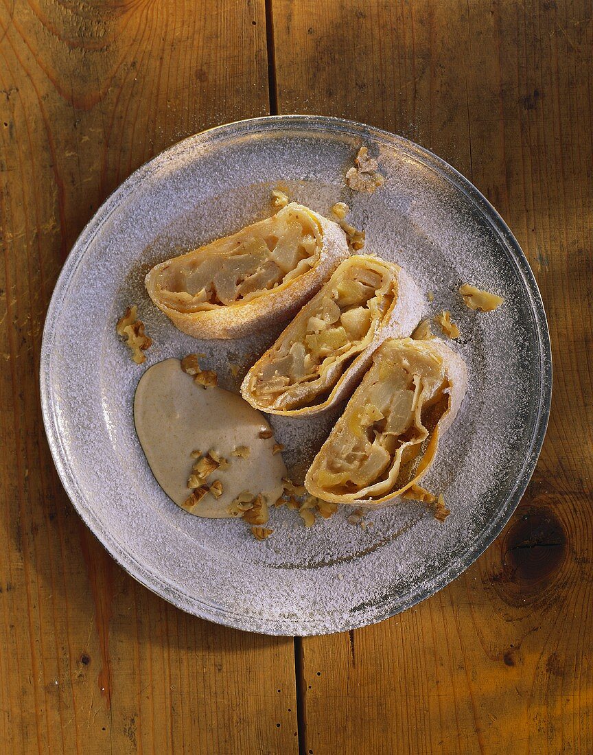 Fruit strudel with sloe whip and chopped walnuts