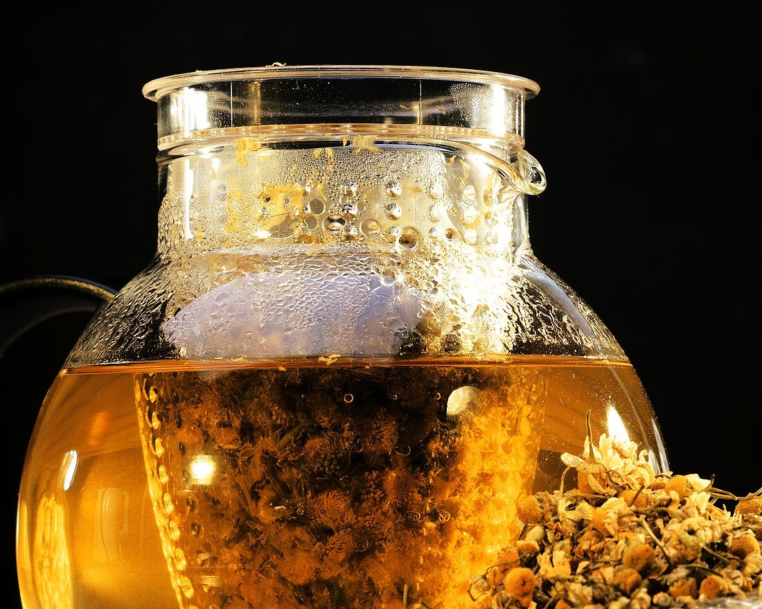 Camomile tea in a glass jug