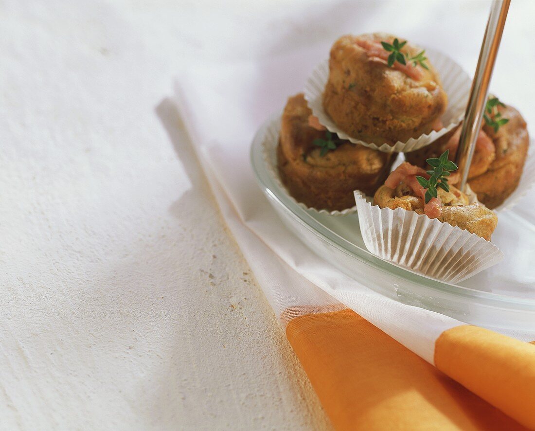 Herb muffins with ham on plate