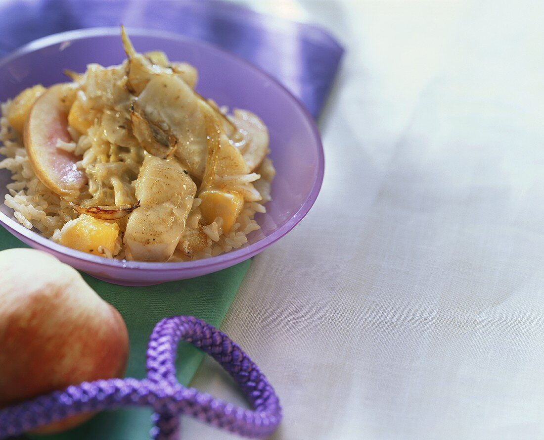 Whiting goulash with mango and rice in a bowl
