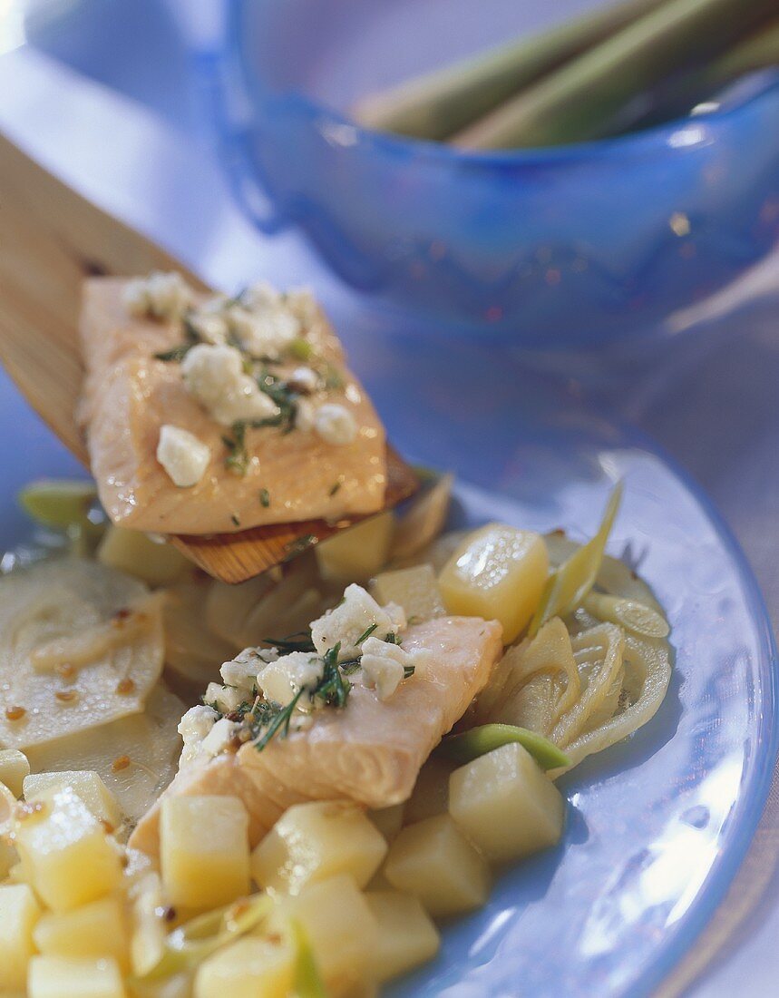 Salmon on fennel and potatoes with feta; lemon grass