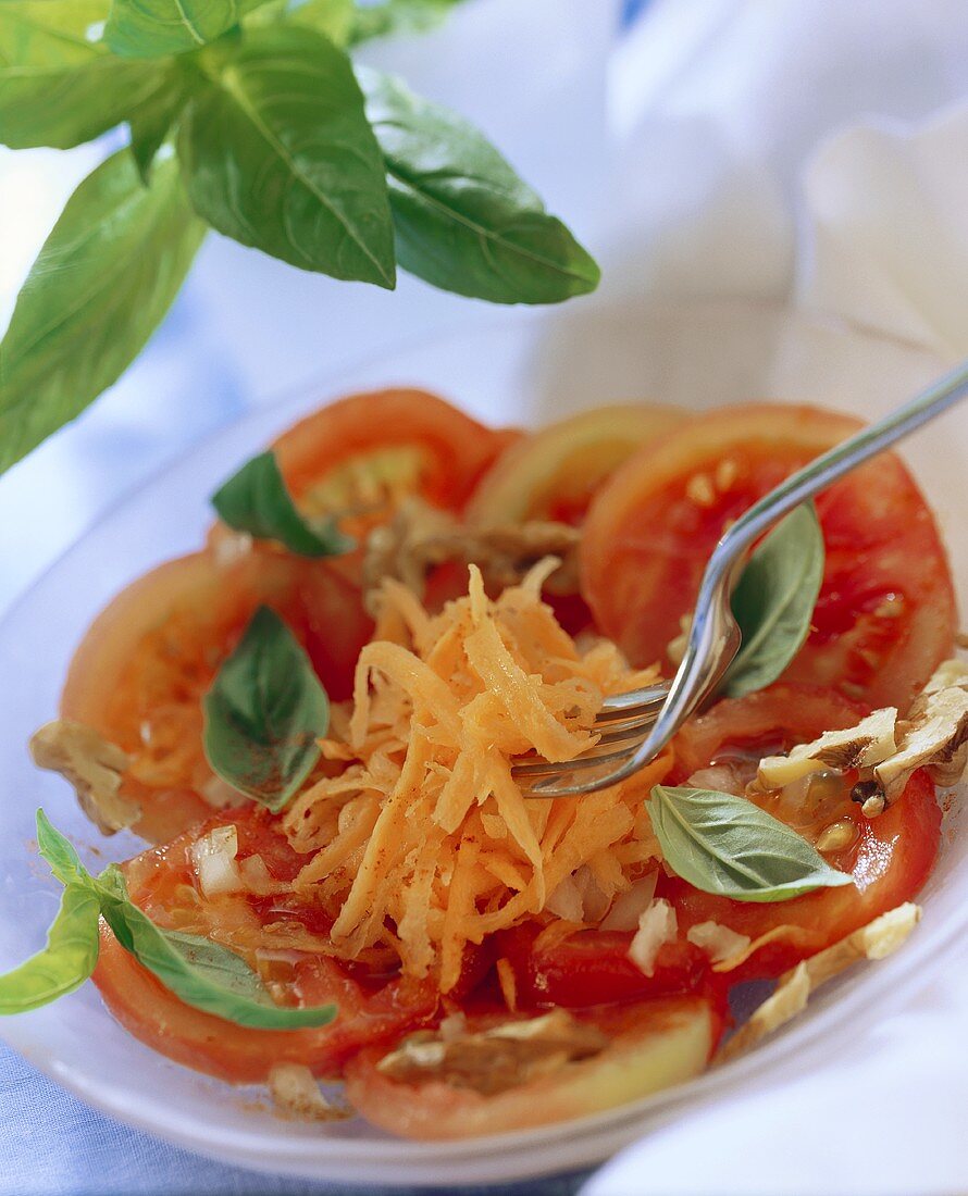 Tomatoes in walnut vinaigrette with carrots and basil