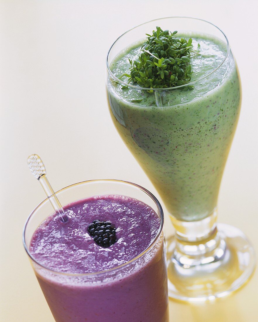Herb kefir with cress and blackberry drink in glasses