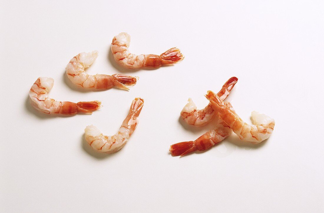 Shrimps, boiled and peeled, on white background