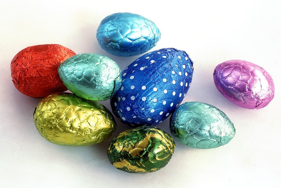 Chocolate eggs in coloured silver paper