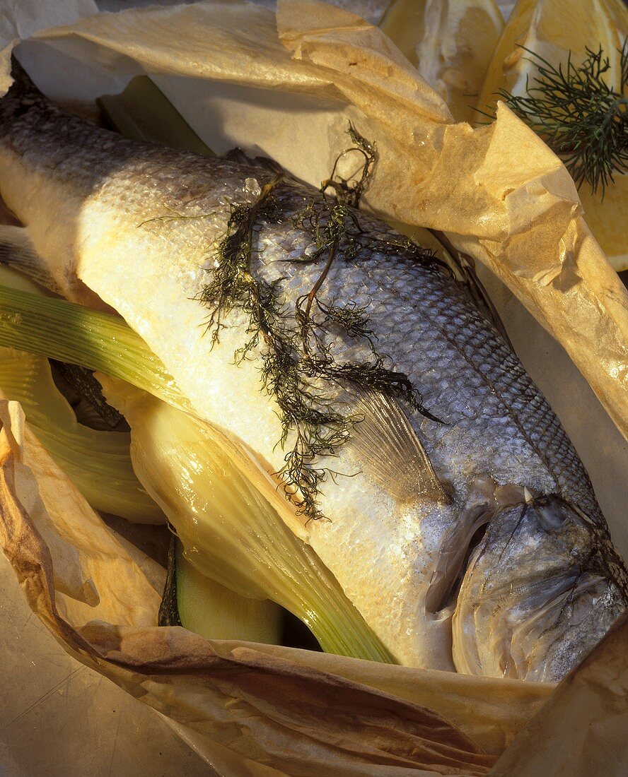 Steamed whole sea perch in greaseproof paper