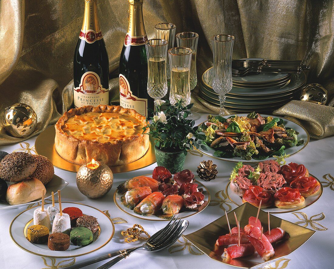New Year's Eve buffet with snacks, salad, cake and champagne