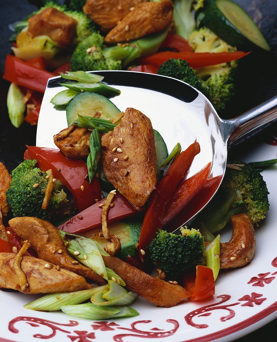 Asian meat and vegetable stir-fry on plate