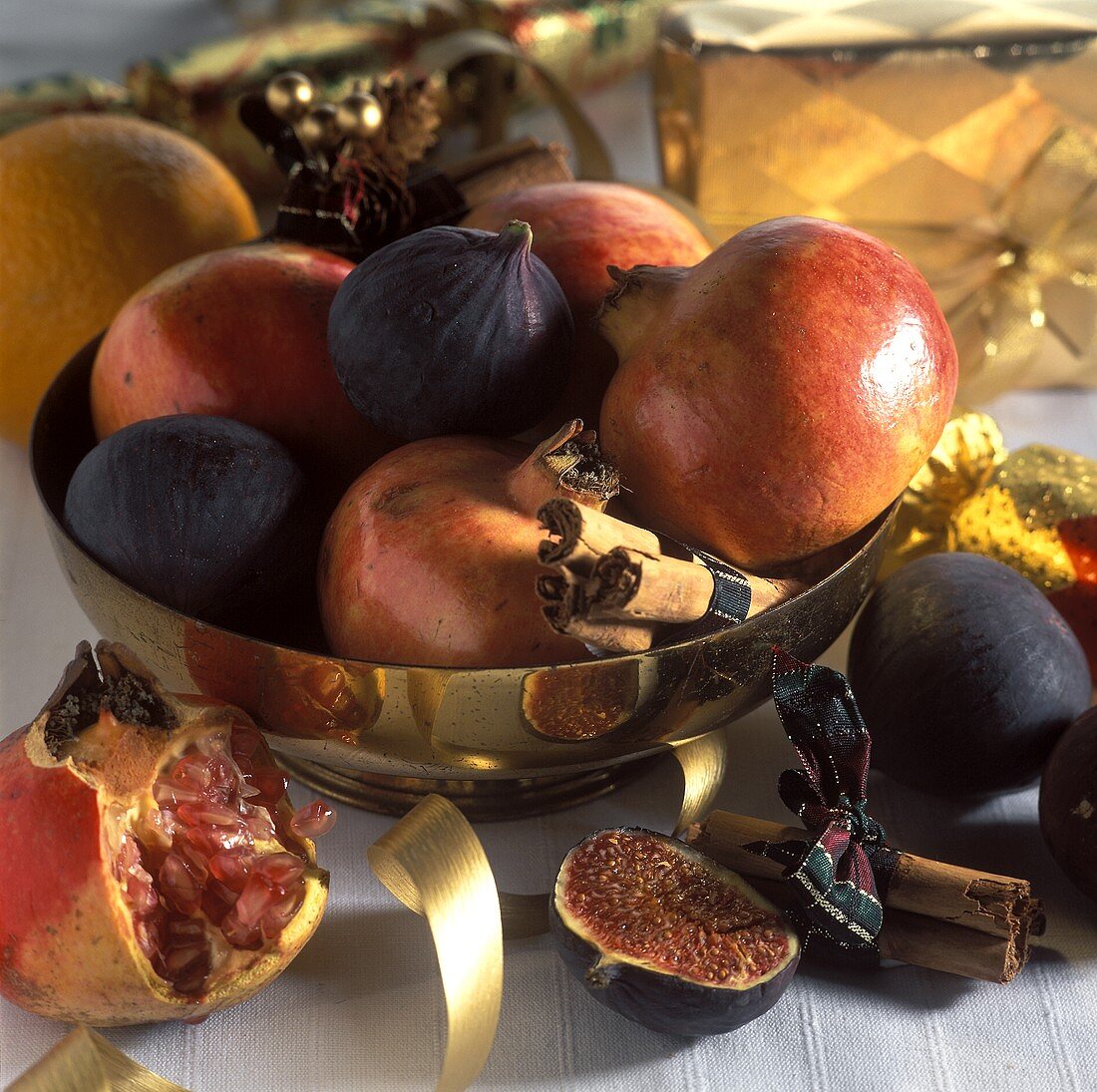 Fresh fruit in a golden bowl; Christmas décor