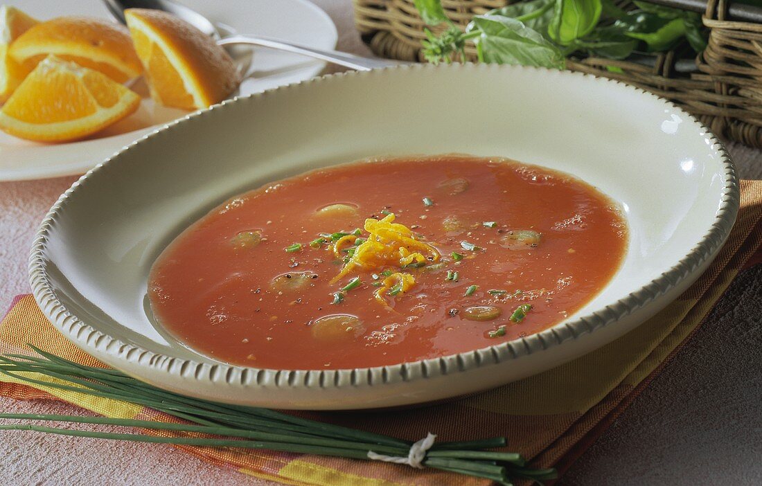 Tomato and orange soup with snipped chives