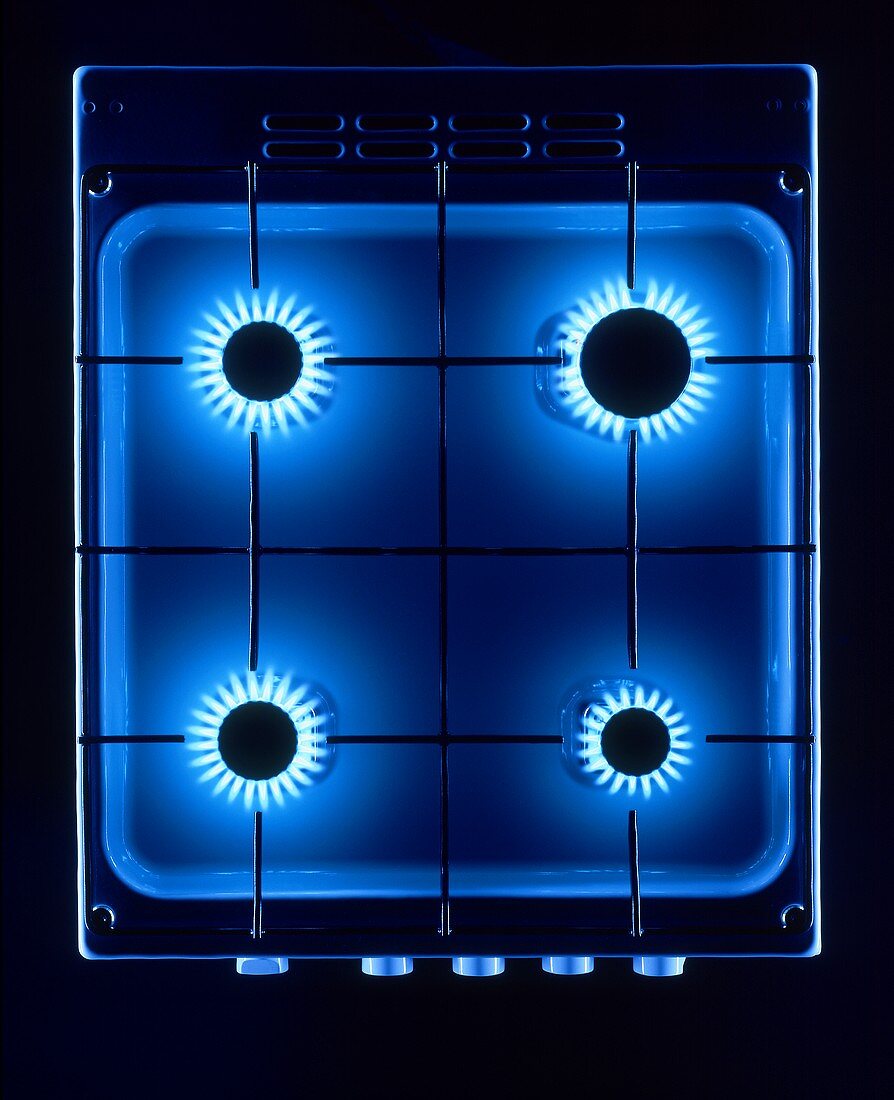 Gas cooker with blue flames from above