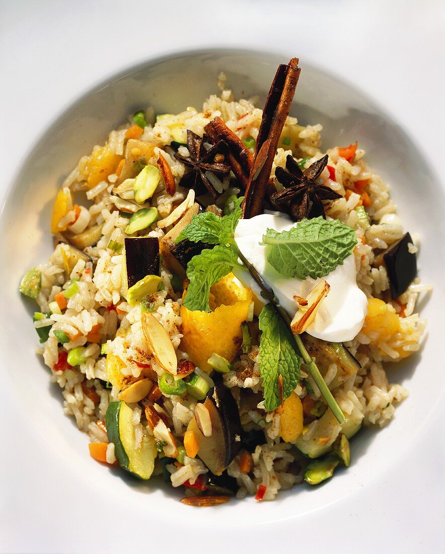 Pilau with spices, vegetables, apricots and yoghurt