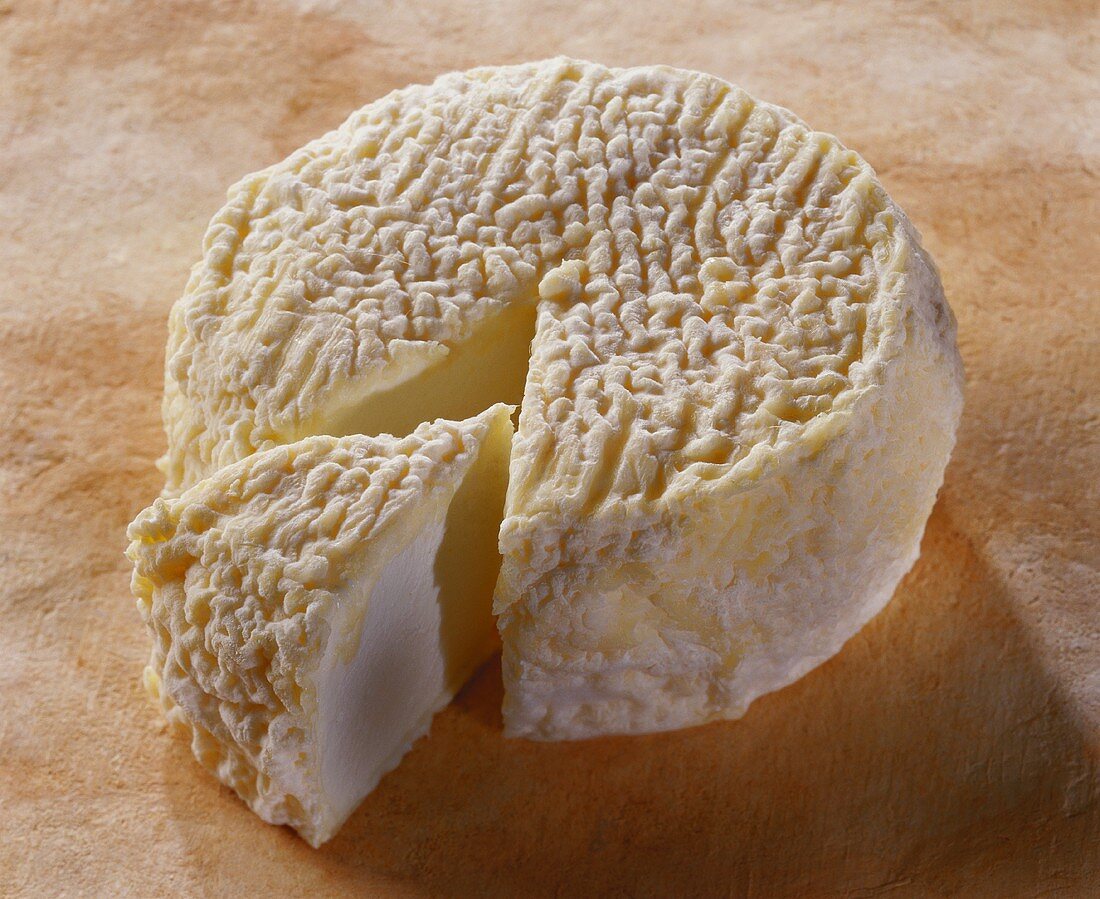 Lunaire, a French goat's cheese, on brown background