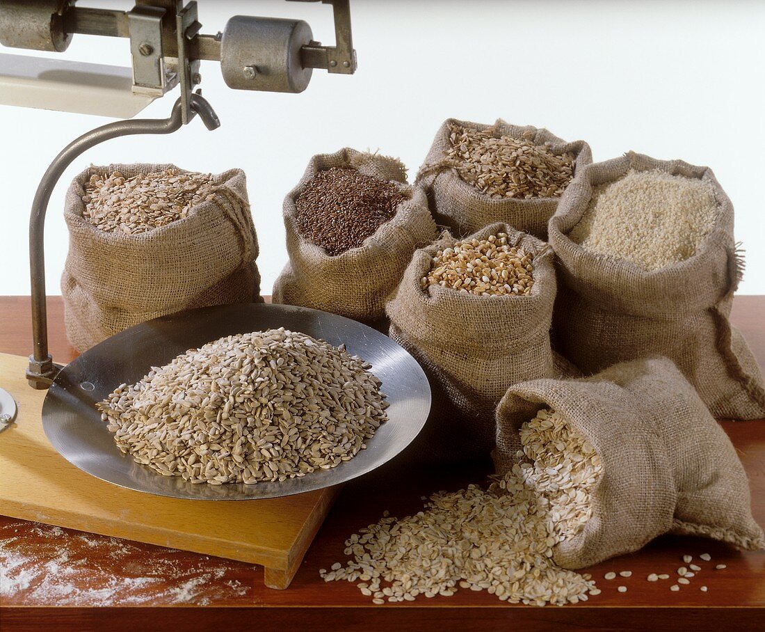 Various types of grain on scales and in sacks