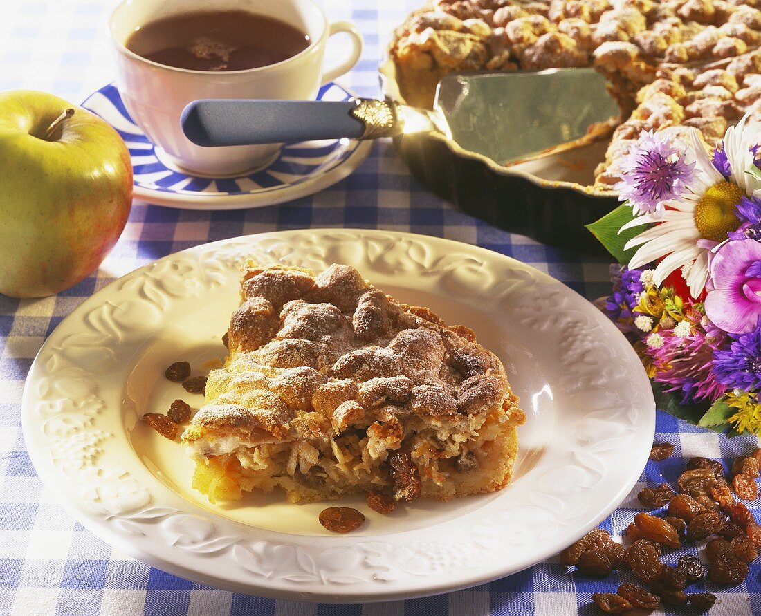 Jewish apple tart with raisins and icing sugar