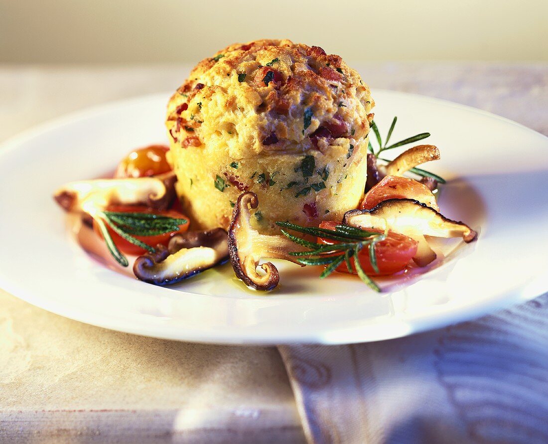 Bacon & bread soufflé surrounded by tomatoes & mushrooms