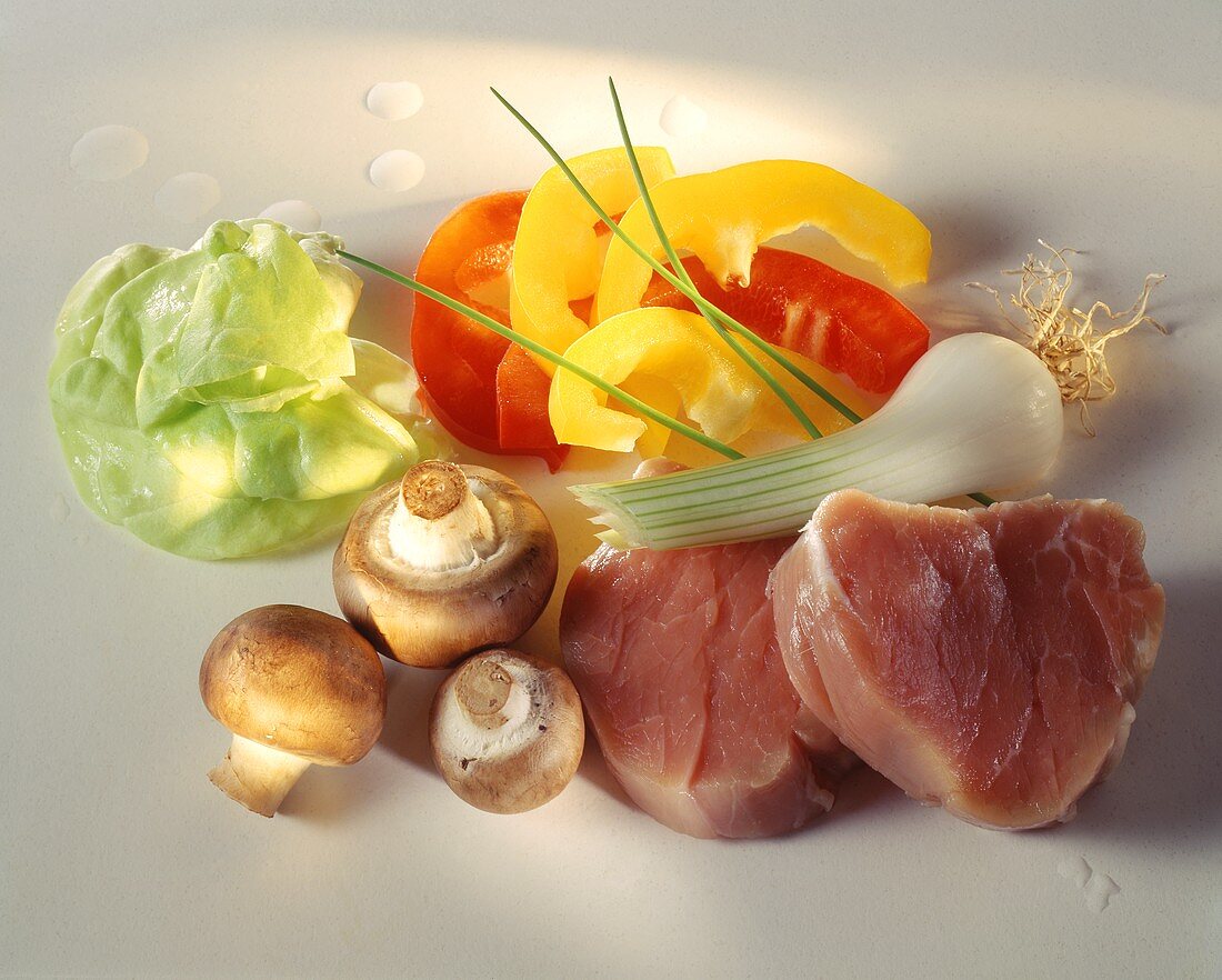 Pork fillet, mushrooms, vegetables and lettuce leaf