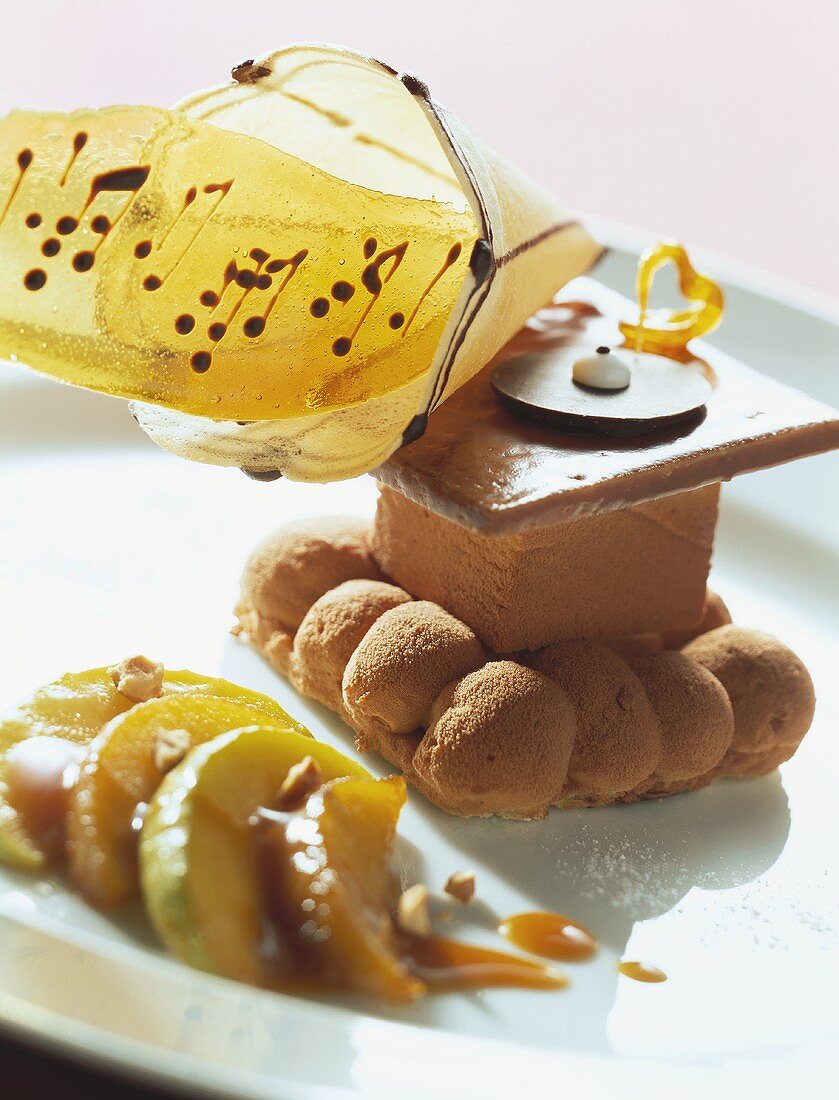 Calvados parfait with wafer decoration and glazed apples